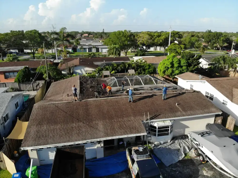 Freshly installed shingle roof with new ridge vent running the length of the peak