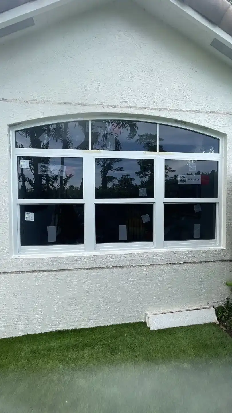 New impact-rated window installed in a stucco wall