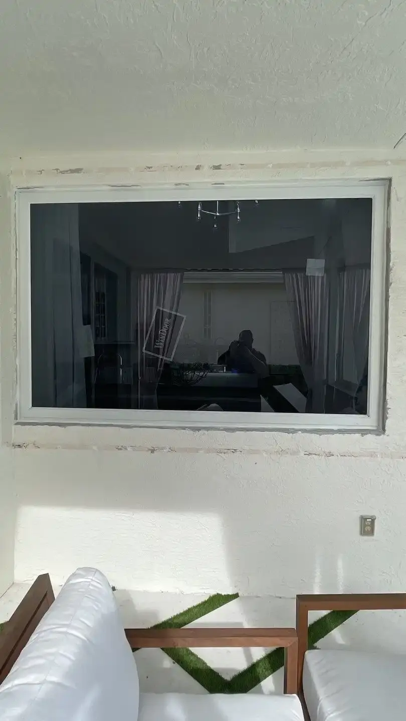 Impact picture window replacing an older aluminum unit