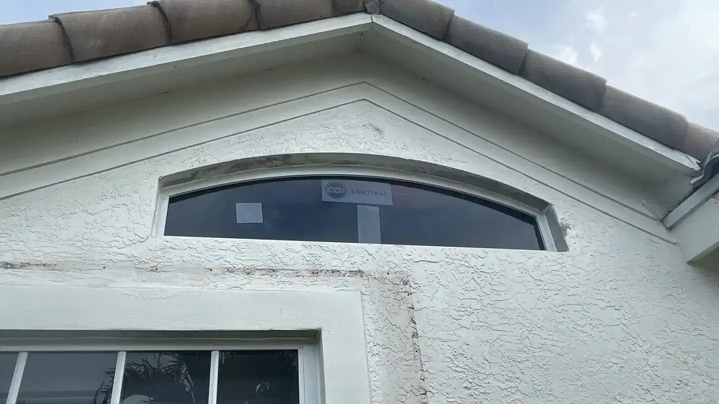 Impact-rated glass entry door installed at the front of a South Florida home