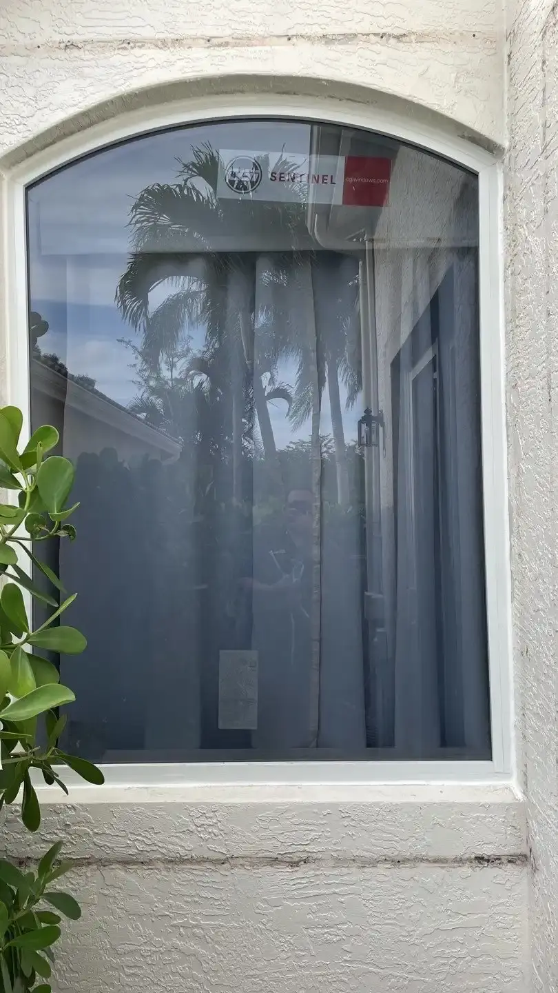 Impact-rated window installed in a stucco opening on a South Florida home