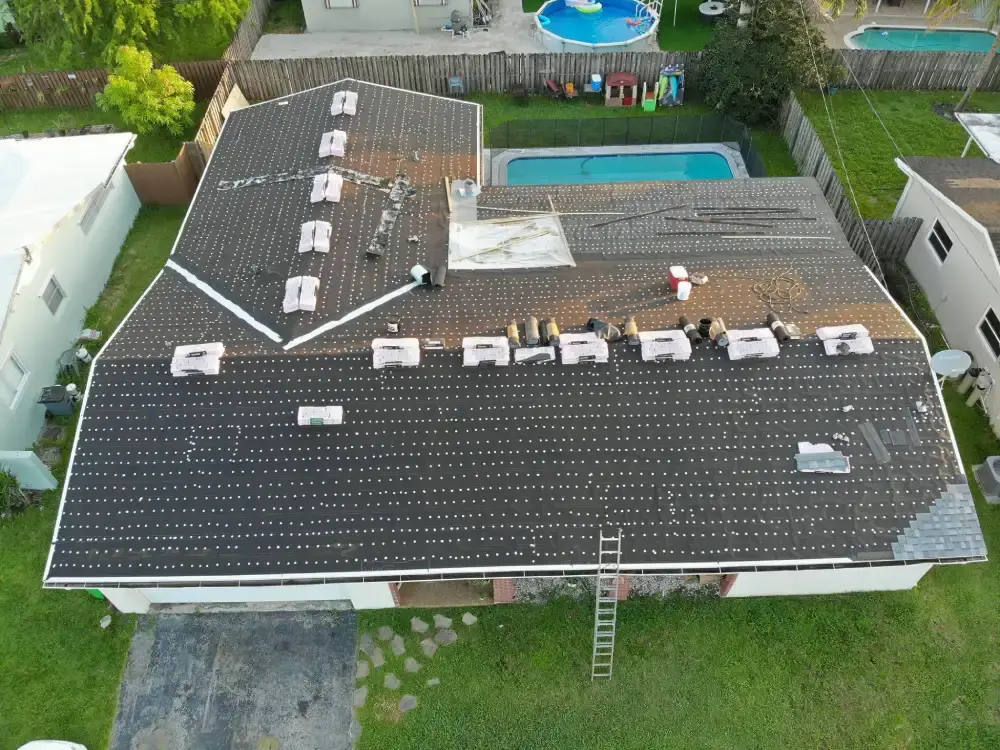 Aerial view of a Fort Lauderdale, Florida neighborhood with roof work in progress