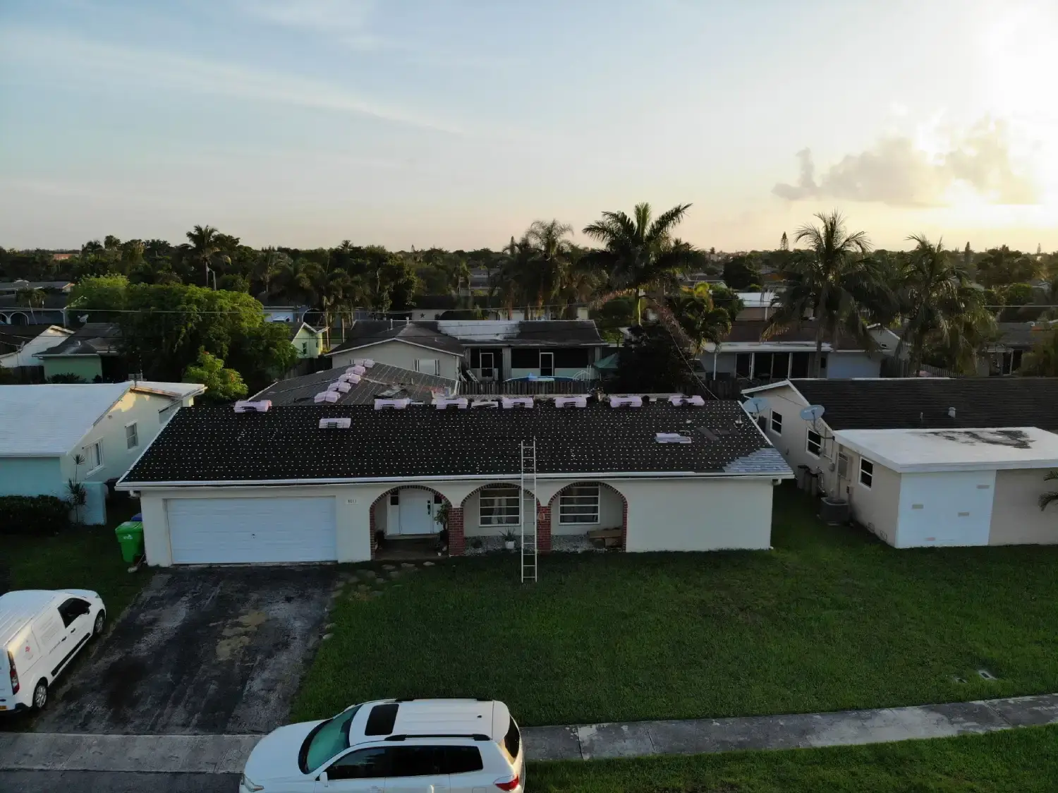 Aerial view of a Hollywood, Florida neighborhood with a roof replacement in progress