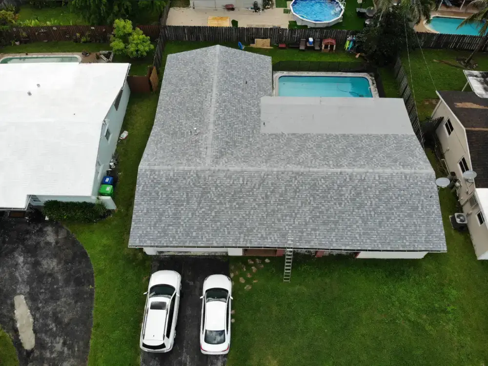 New architectural shingle roof on a corner-lot home in Broward County